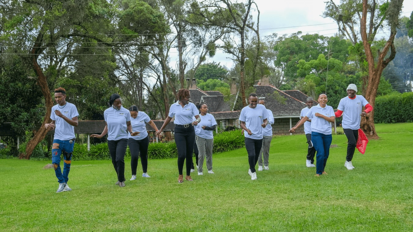 A corporate team learning a dance routine